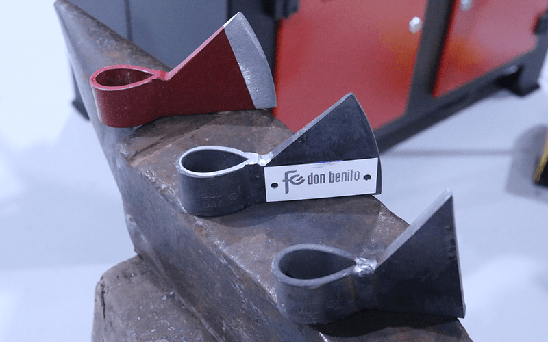 Load image into Gallery viewer, Close-up of heated steel being formed through the Nargesa NF70 ornamental rollers