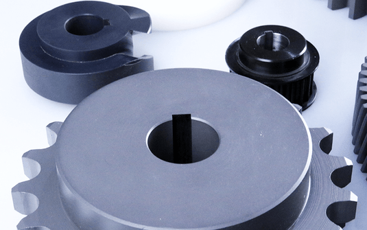 Close-up of metal components including a sprocket with precision keyway cut by the Nargesa BM25