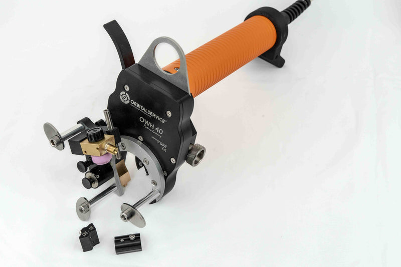 Load image into Gallery viewer, Orbital Service OWH 40 Open Weld Head with orange handle and clamp inserts for small diameter pipe welding
