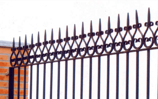 Nargesa NF70 hot wrought iron machine shown with a decorative iron fence featuring formed bar ends