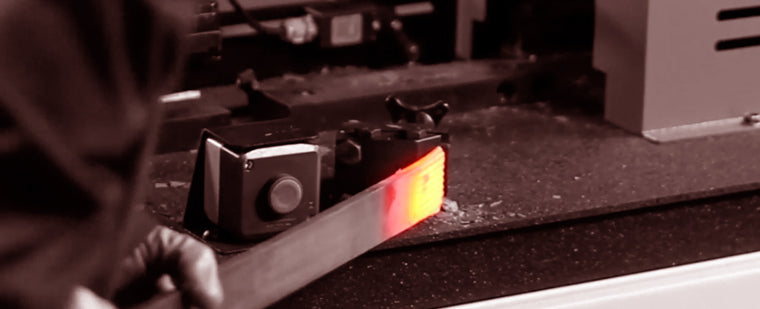 Load image into Gallery viewer, Heated steel bar being positioned in the Nargesa PC16 forging station
