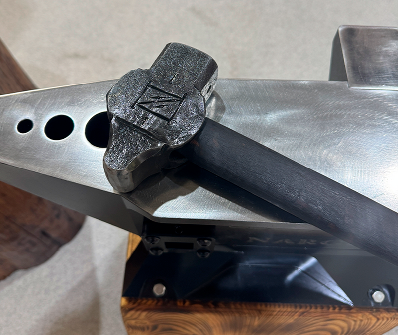 Load image into Gallery viewer, Close-up of heated material being formed in the Nargesa PV21 forging dies
