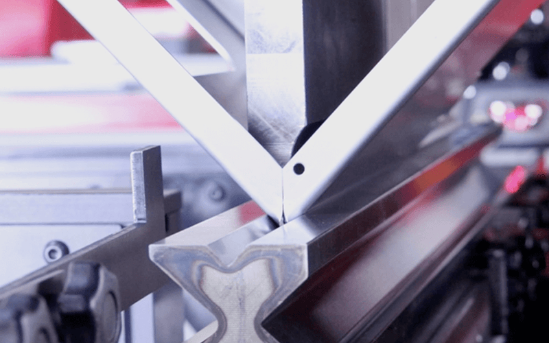 Load image into Gallery viewer, Close-up of punch and die performing a sharp-angle bend on the Nargesa MP1500CNC
