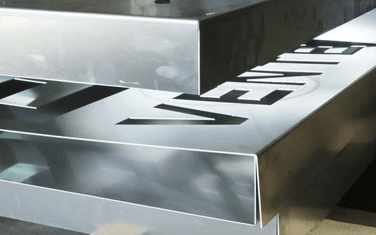 Close-up of sharp, clean bends on stainless steel panels formed on the Nargesa MP3160CNC