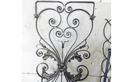 Ornamental ironwork panel with scrolls and decorative details formed on the Nargesa MT150A