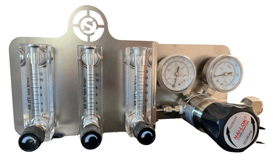 Orbital Service pressure regulator with three flowmeters mounted on stainless steel plate, dual gauges, and NAI-LOK adjustment knob
