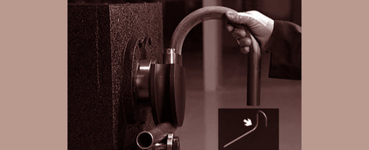 Operator forming a curved hook on the Nargesa MT500A ornamental bending station