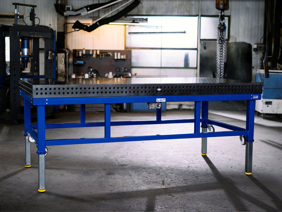 PETec height-adjustable frame carrying a large Siegmund System 16 welding table