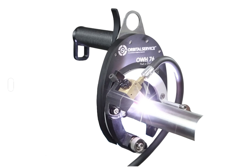 Load image into Gallery viewer, Orbital Service OWH 76 Open Weld Head performing orbital TIG weld on stainless steel pipe with bright arc
